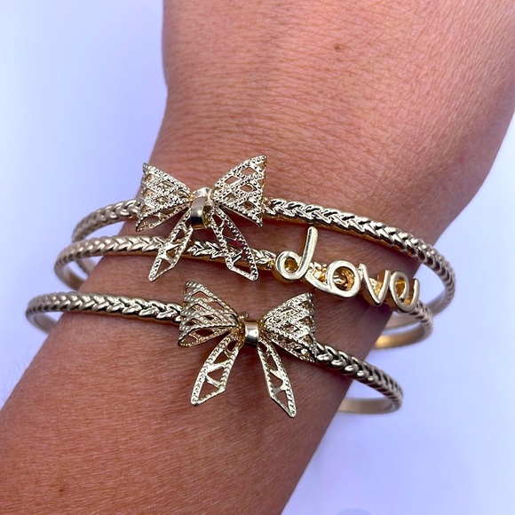 Vintage Gold Tone Set of Three Bow Love Bangle Bracelets - Picture 1 of 2